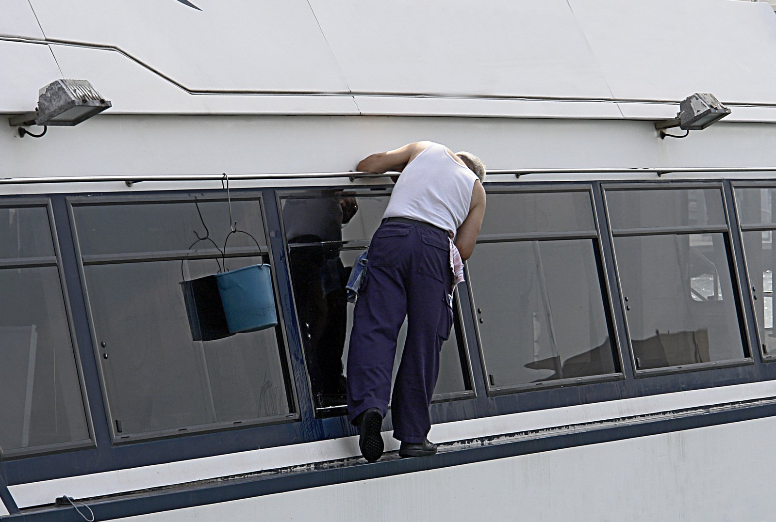man cleaning window